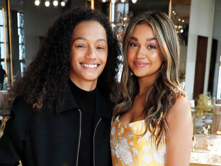 Madison Bailey and Mariah Linney smiling and embracing each other, while posing for a photo.