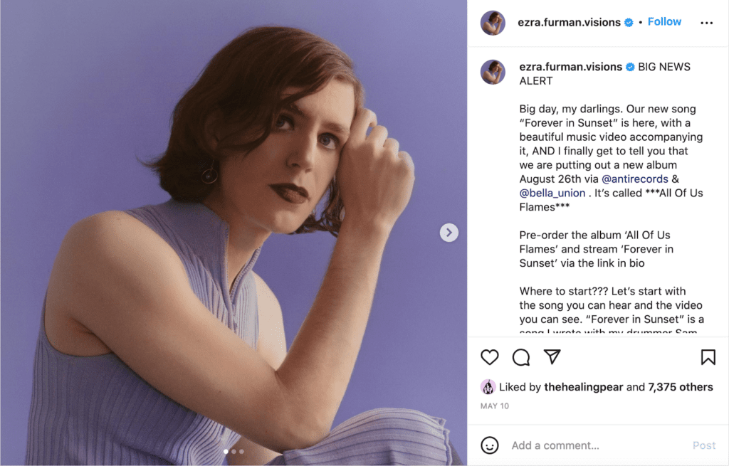 Instagram post of Ezra Furman in a purple outfit and make-up

