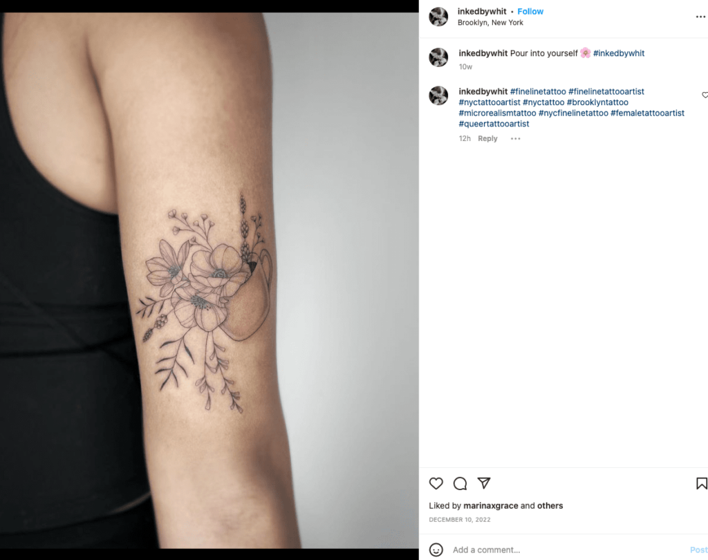 The picture shows a detailed flower tattoo by Inked by Whit, a Brooklyn-based queer tattoo artist. You can book them on their website for flash tattoos or other kinds of tattoos on their website.