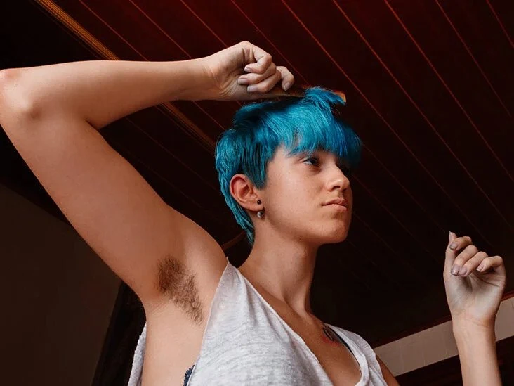 Androsexual cutie combing their blue hair
