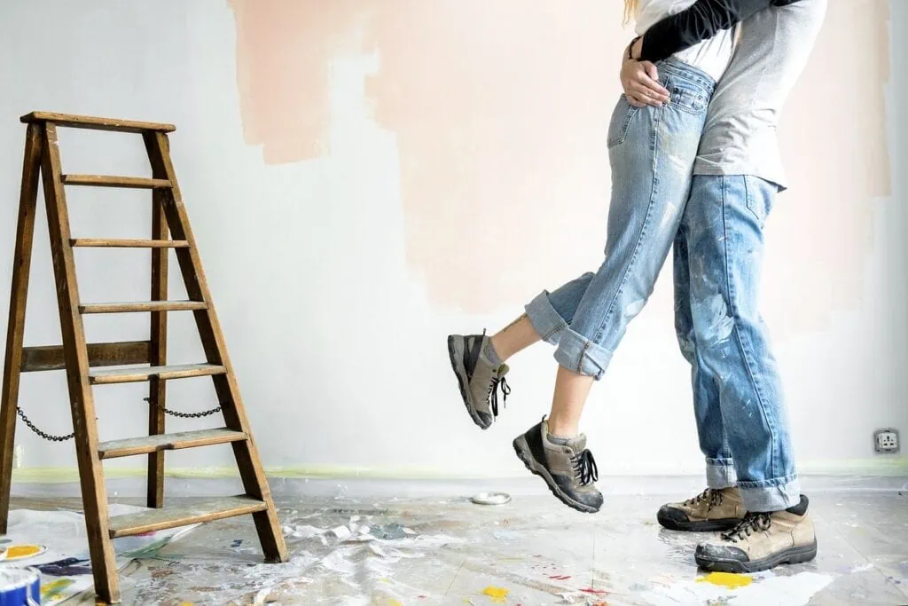 A happy couple renovate a house together