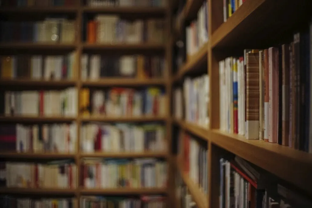 Bookshelves full of books. Libraries and bookstores are great places for a quiet, low-key, free date idea.