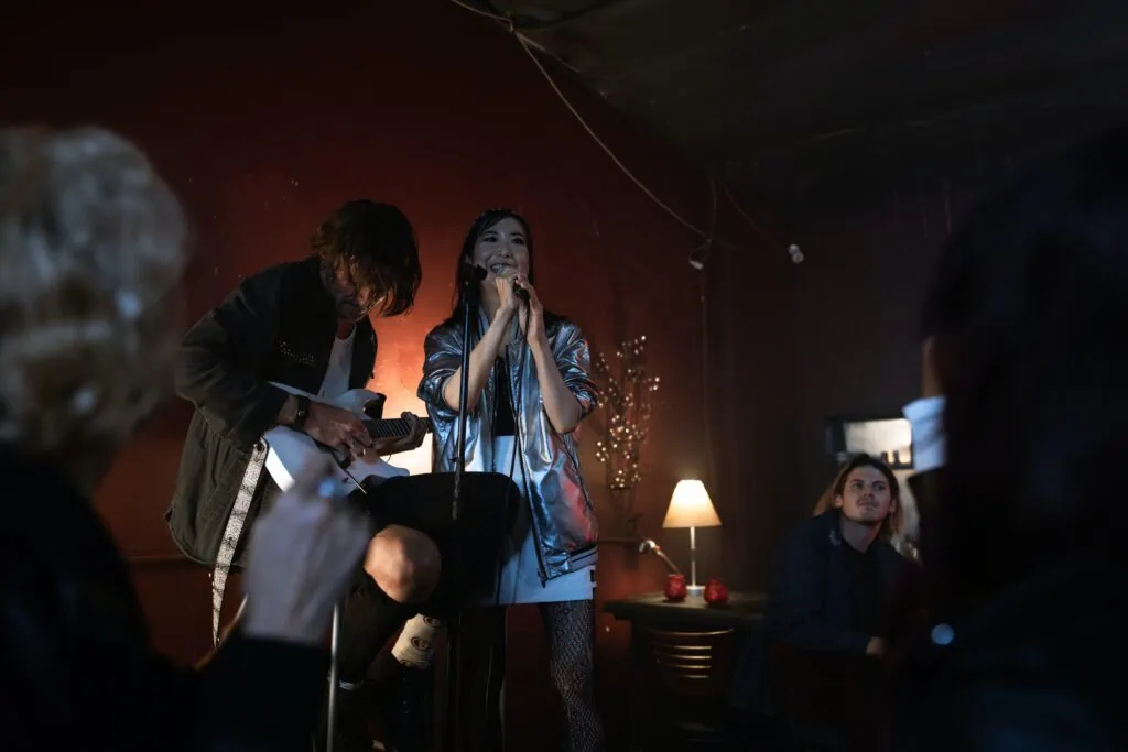 A woman sings on stage