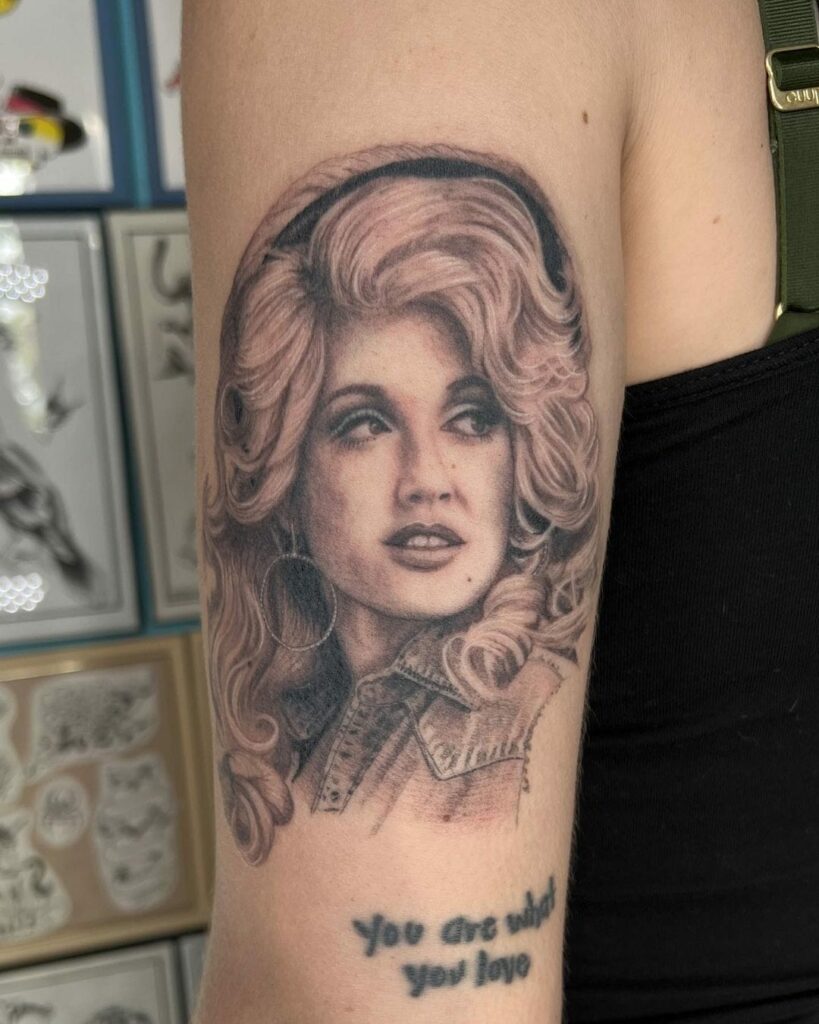 A tattoo portrait of Dolly Parton by Shannon E Perry