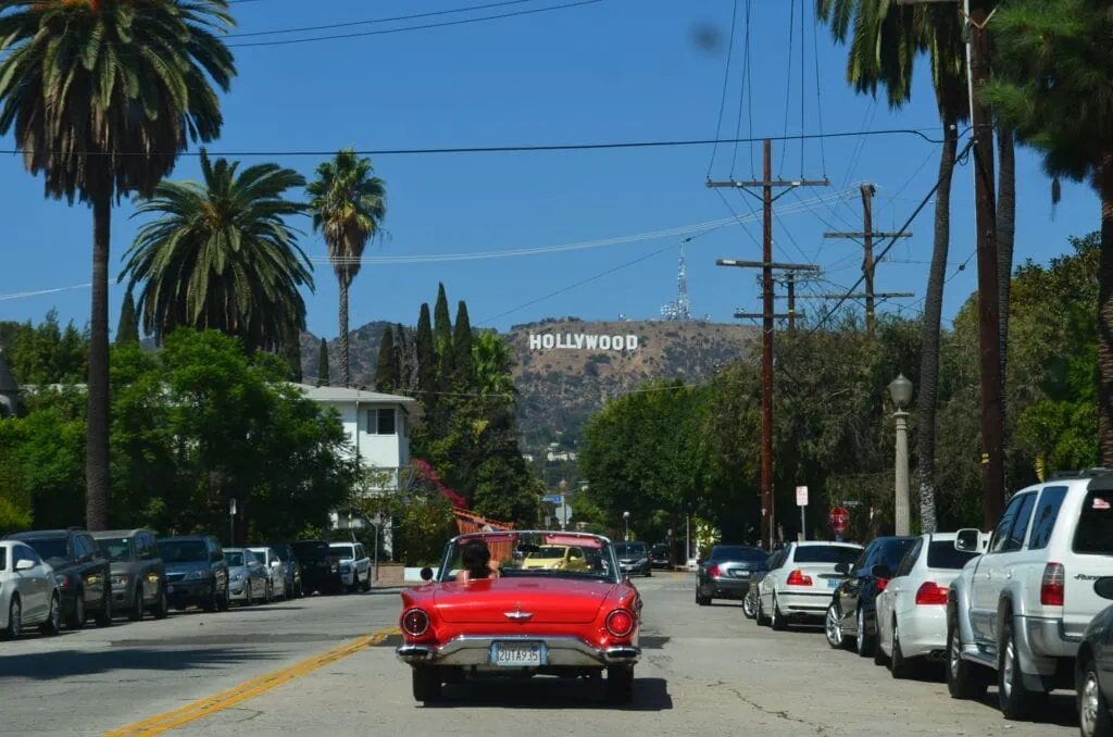 A lesbian driving around in a red convertible in WeHo, Los Angeles