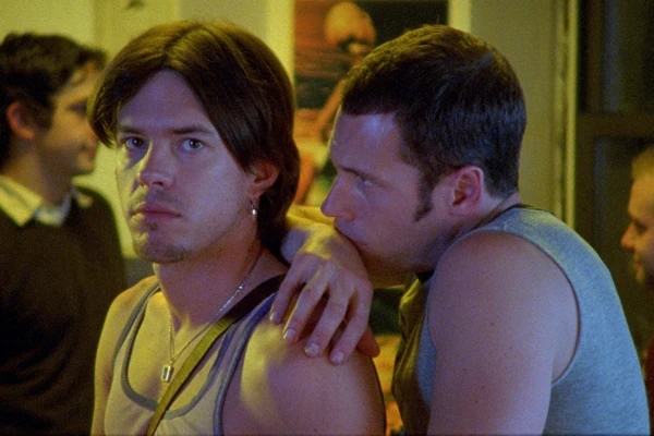 Paul Dawson and PJ DeBoy in ‘Shortbus.’ One of them looks straight at the camera while the other looks at the back of his head adoringly. 