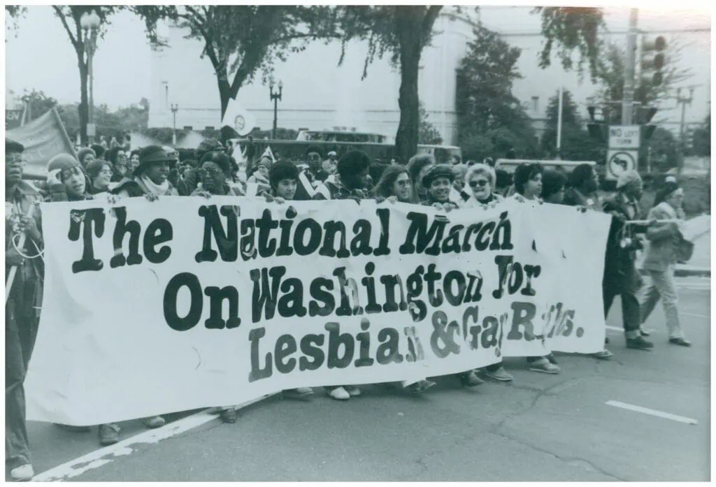 A group of protesters marching with a banner that reads, "The National March On Washington for Lesbian & Gay Rights"