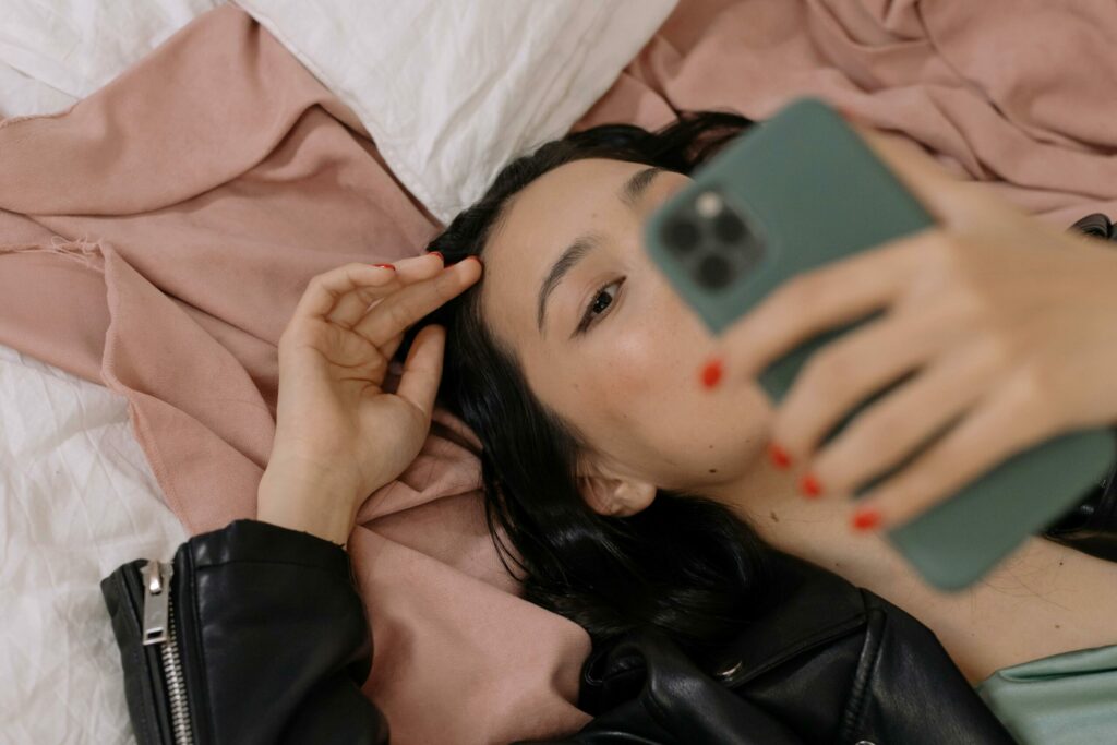 Woman lying down with phone