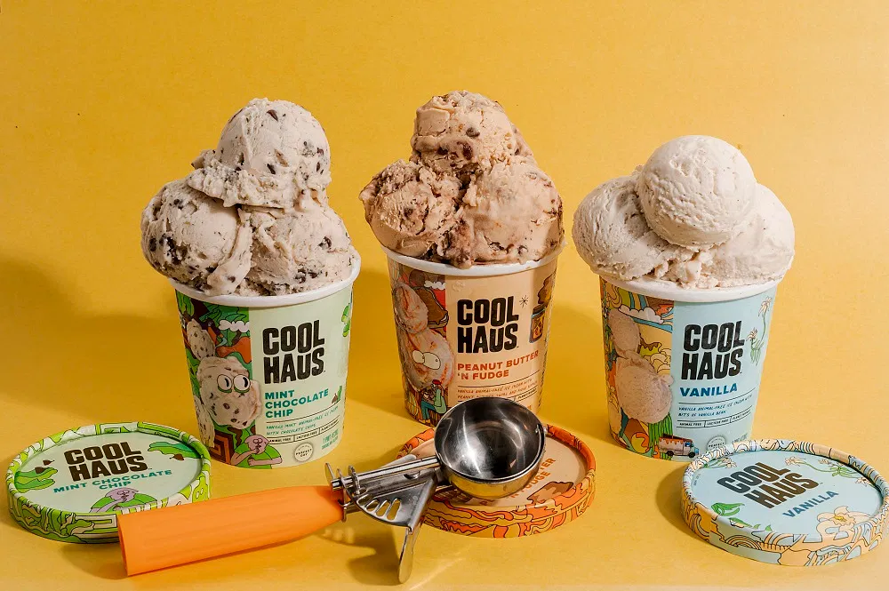 Three ice cream pints over a yellow background.