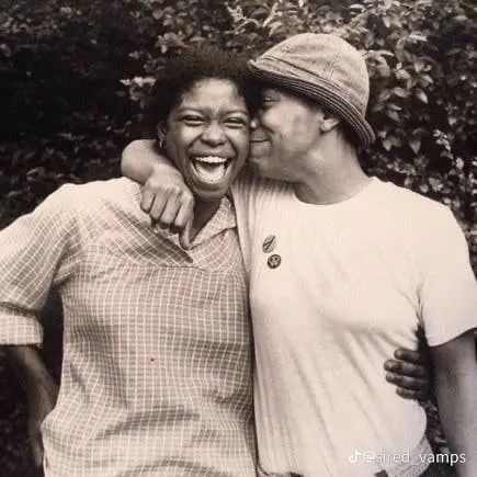 Lesbian couple smiling and hugging 