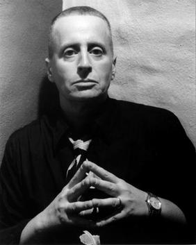 Leslie Feinberg in black shirt and tie