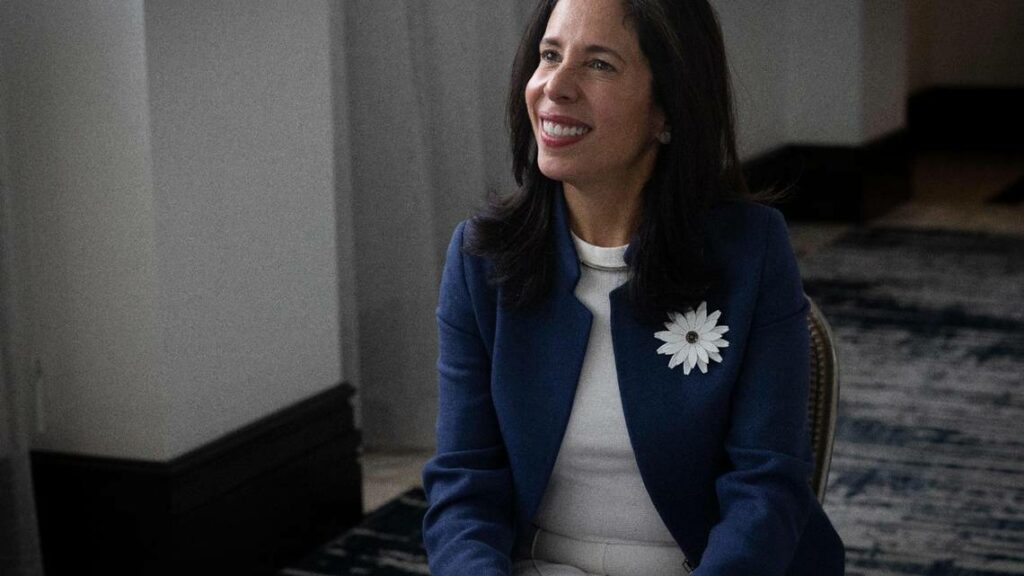 Priscilla Almondovar smiling at someone off-camera.