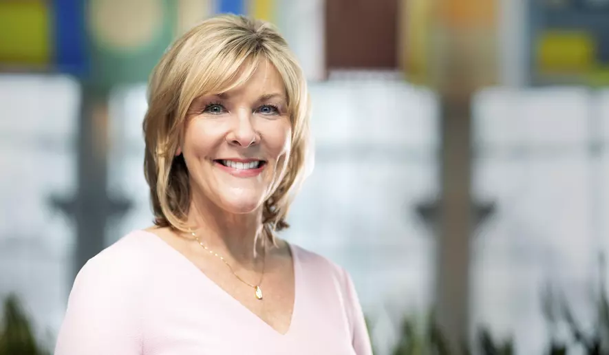 Headshot of Tricia Griffith smiling.