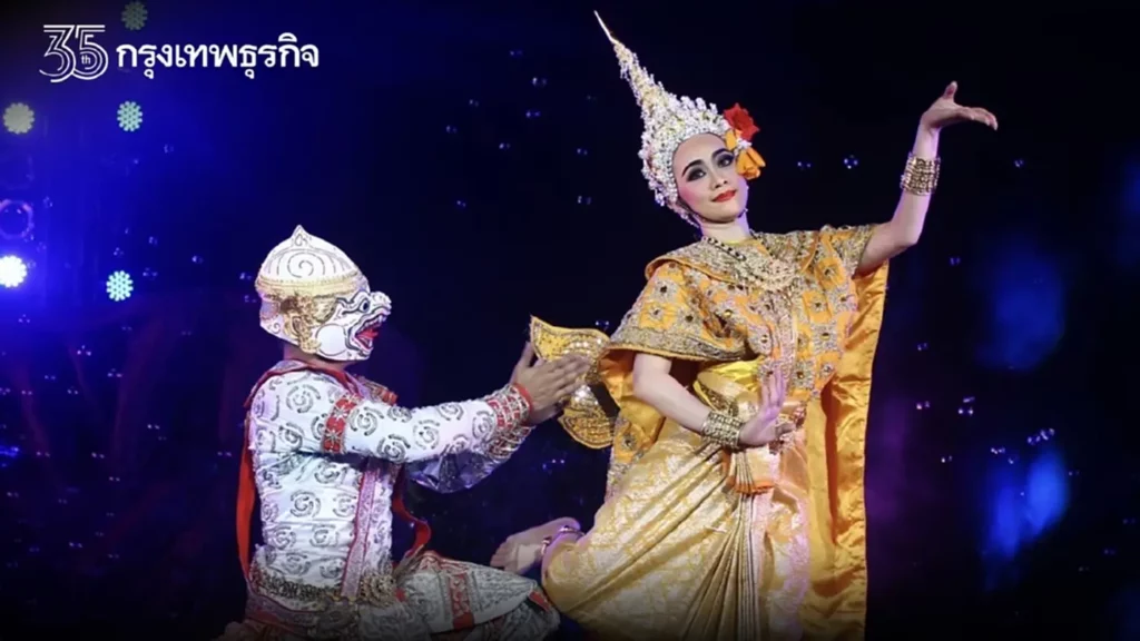 Traditional Khon Nang performance from King Rama I’s era in Thailand, showcasing elaborate costumes and masks, with performers enacting a classical Thai dance drama against a historic backdrop.