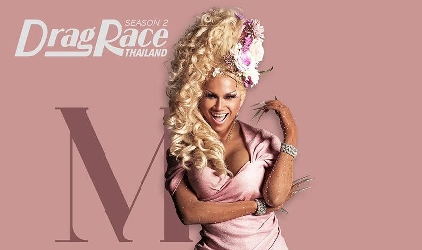 Image of M Stranger FOX on the poster of Drag Race Thailand Season 2. She is striking a confident pose, wearing a vibrant pink costume complemented by a blonde wig adorned with flowers.