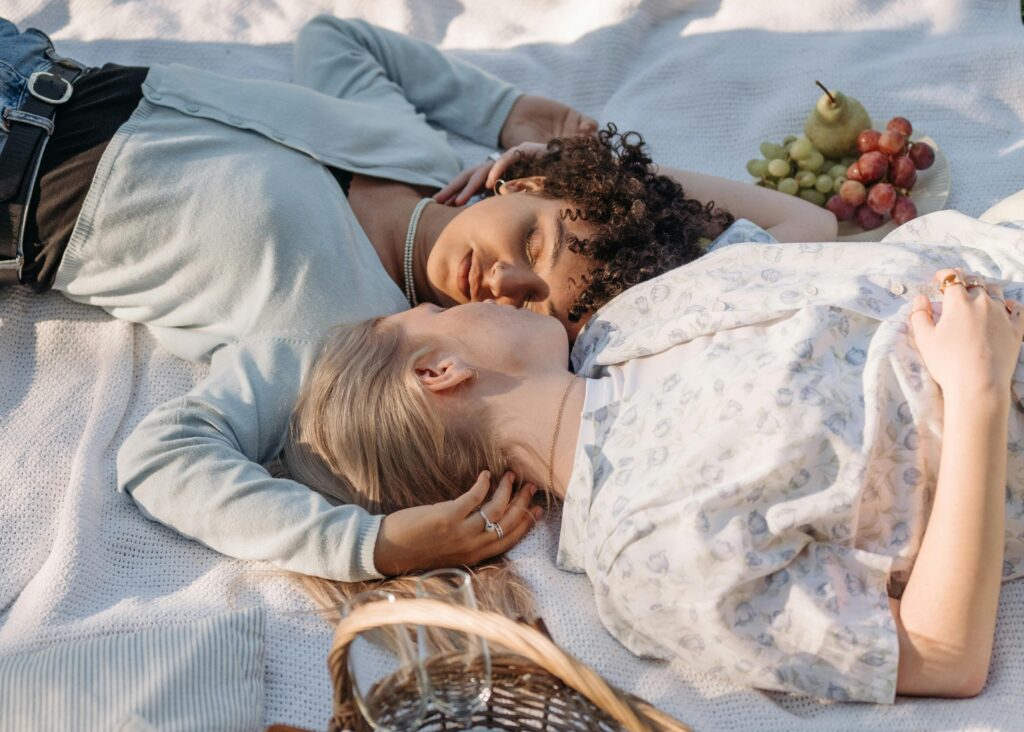 Two lesbians on a date embracinig in a peaceful moment on Valentine's Day at a park in Los Angeles, gazing into each other's eyes