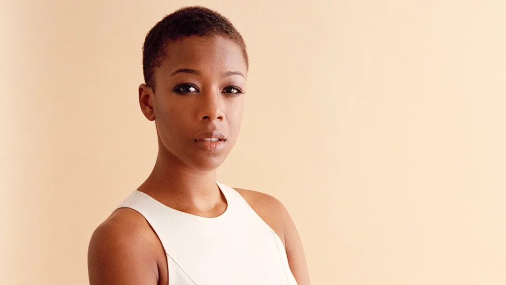 African American actress Samira Wiley poses for a photo, wearing a white top.