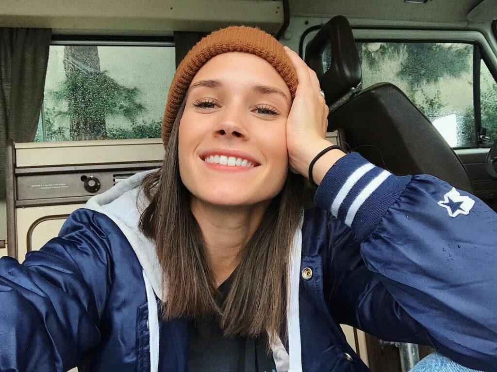 Photo of Shannon Beveridge smiling and taking a selfie.