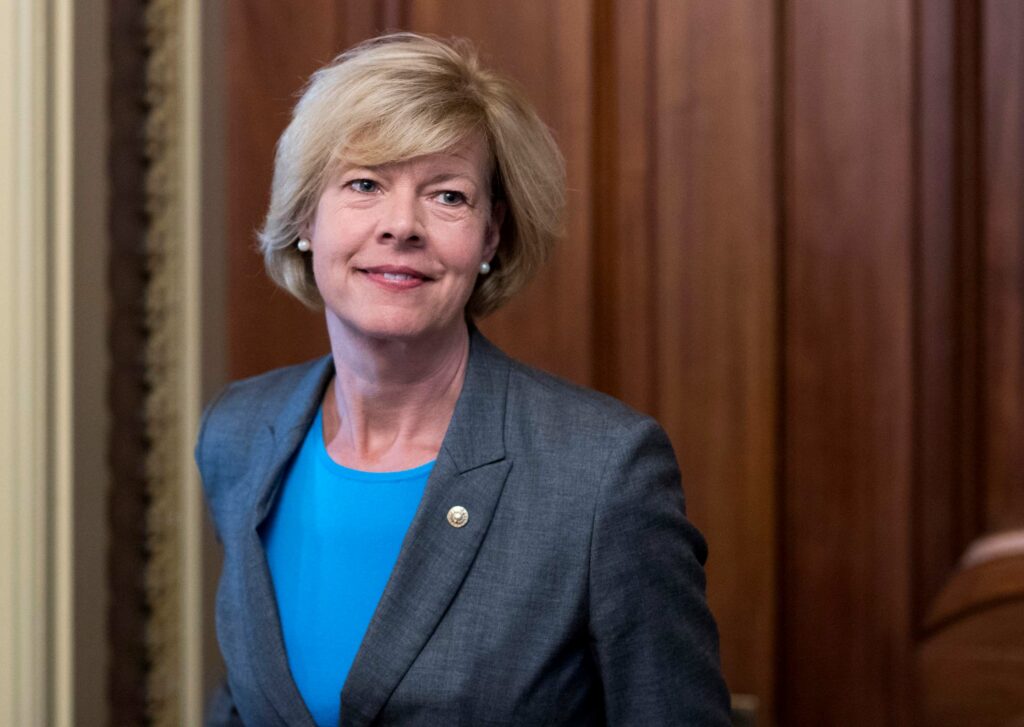 Tammy Baldwin of Wisconsin in a suit, smiling.
