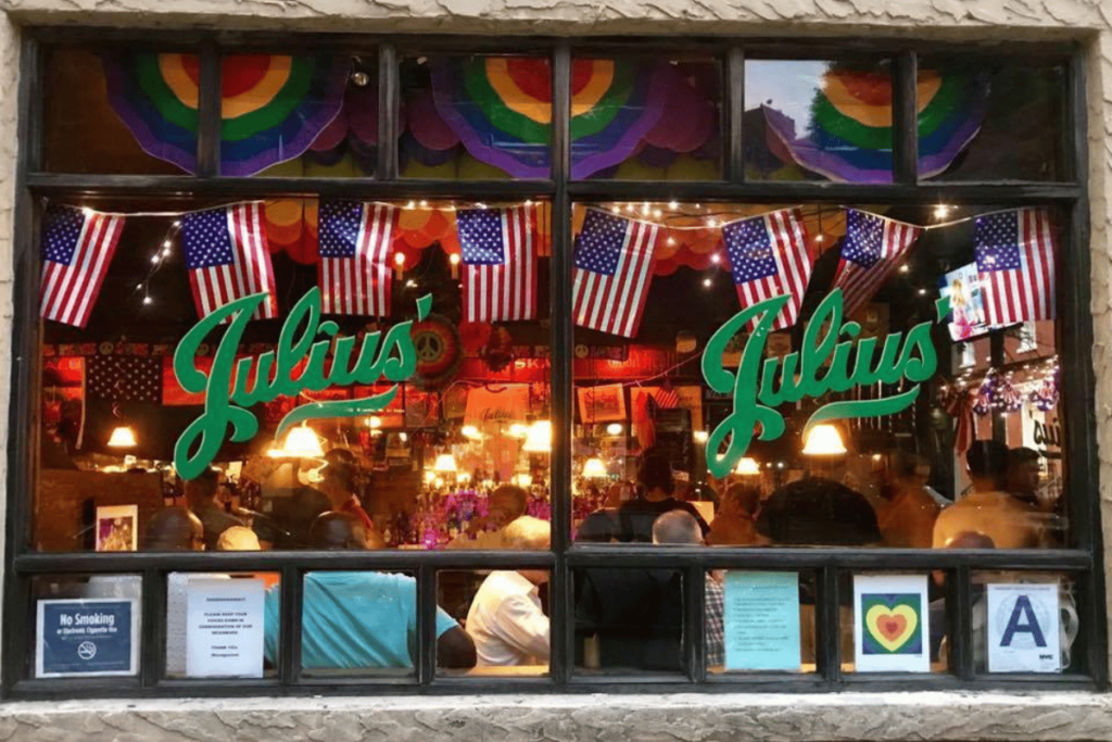 Julius' in New York: the city’s oldest gay bar adorned with pride and US flags, known for its welcoming atmosphere and burgers