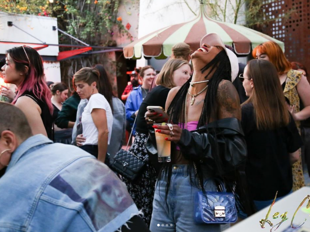 a group of lesbians having a good time together at a bar in LA during the pride month