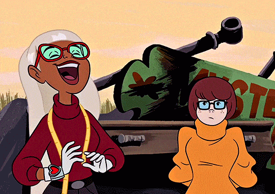 Velma Dinkley from Scooby-Doo, wearing her iconic orange turtleneck and glasses, laughing with her eyes closed and mouth open, saying 'swoon' with a cheerful expression.