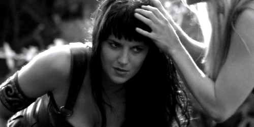 Black and white image of Xena receiving a soothing head massage.